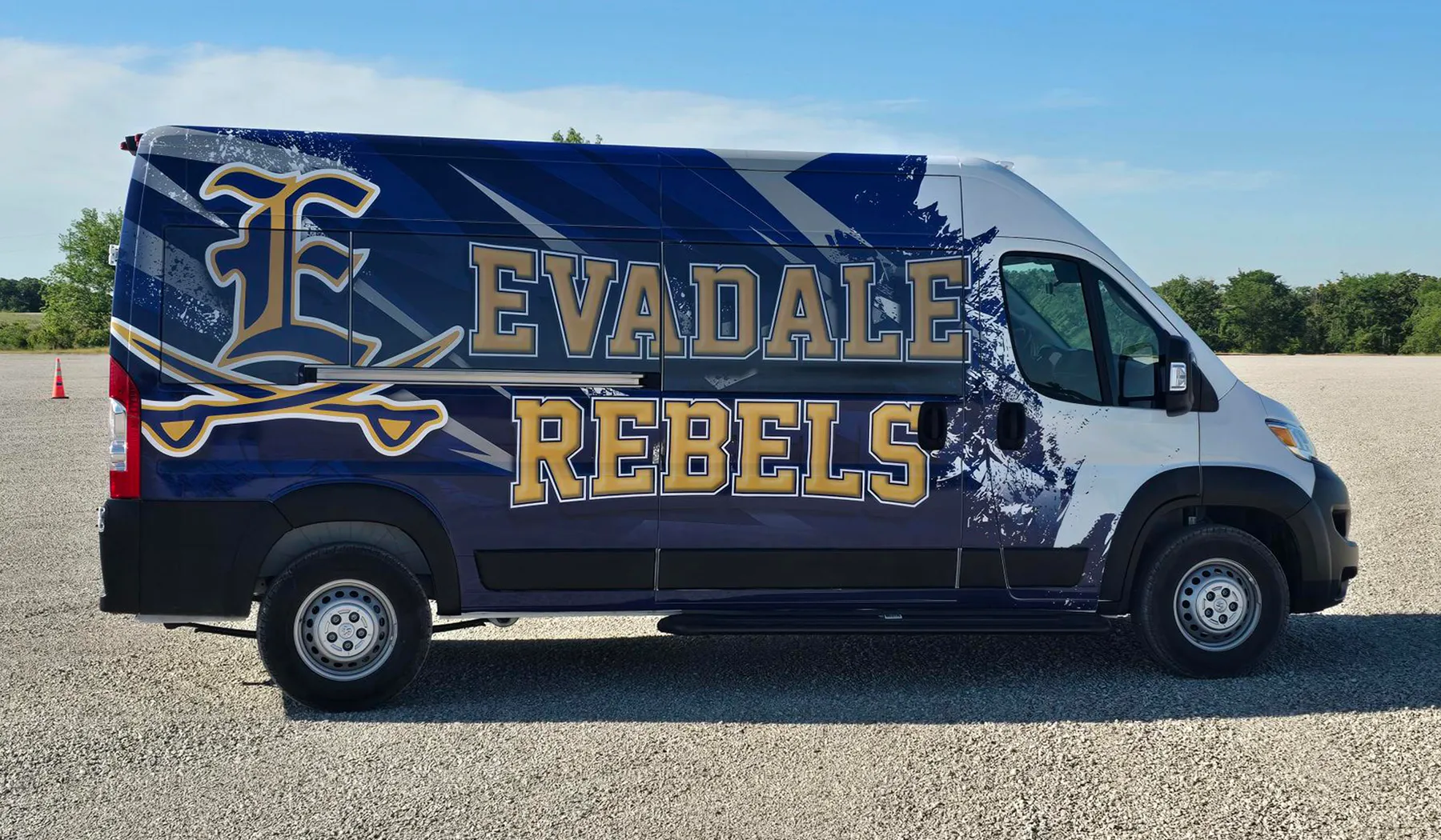 Side view of a Evadale Rebels shuttle wrapped by National Wrap Co.
