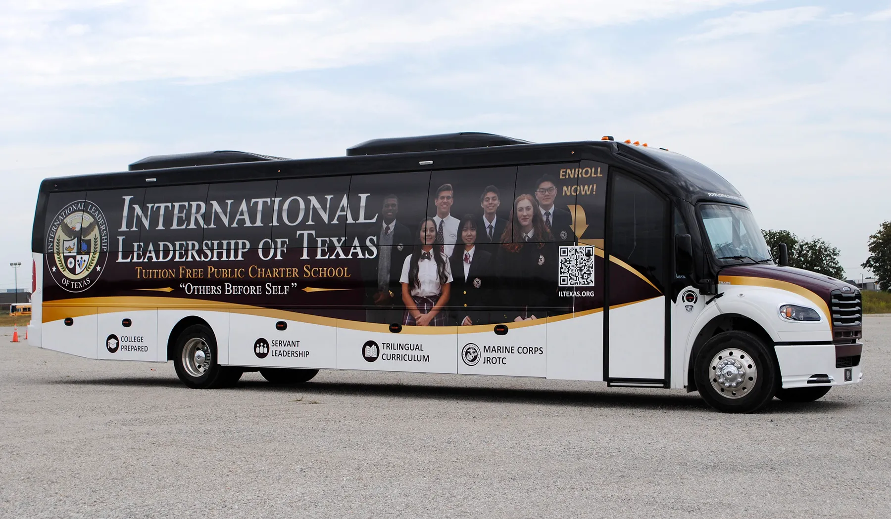 Side view of a International Leadership of Texas Ultra Coachliner wrapped by National Wrap Co.