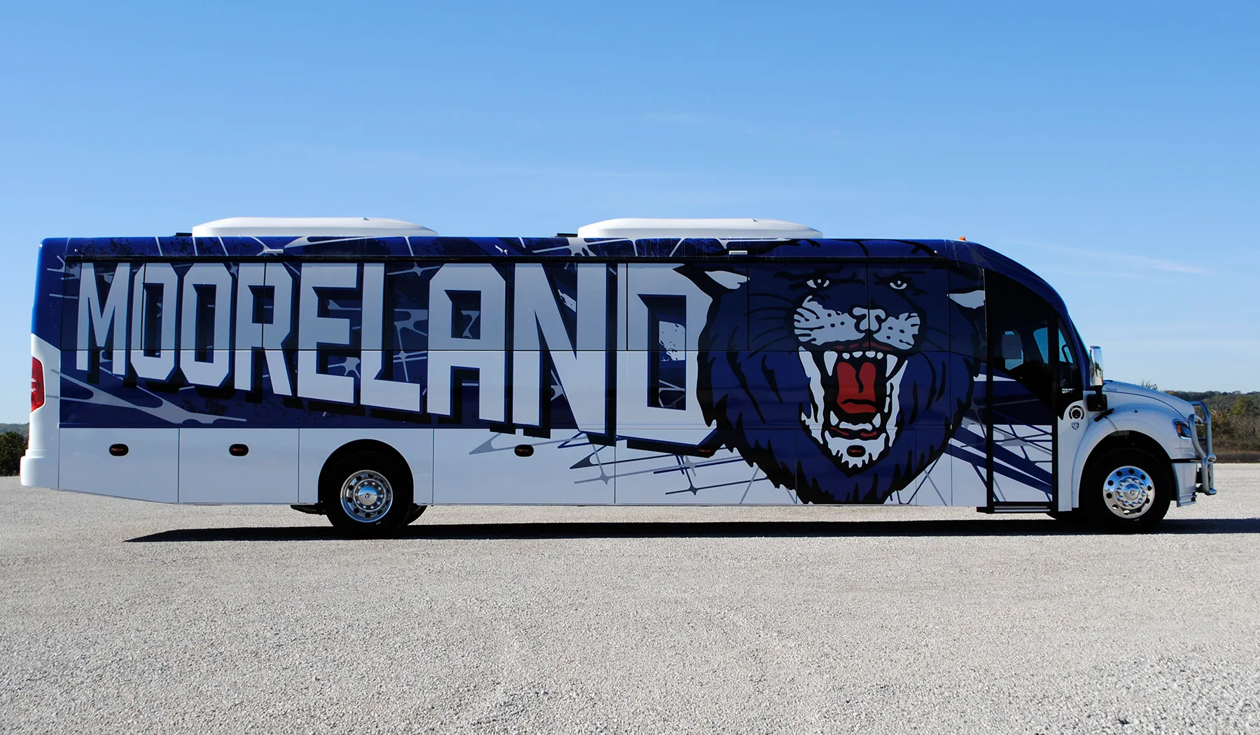 Side view of a Moreland Ultra Coachliner wrapped by National Wrap Co.