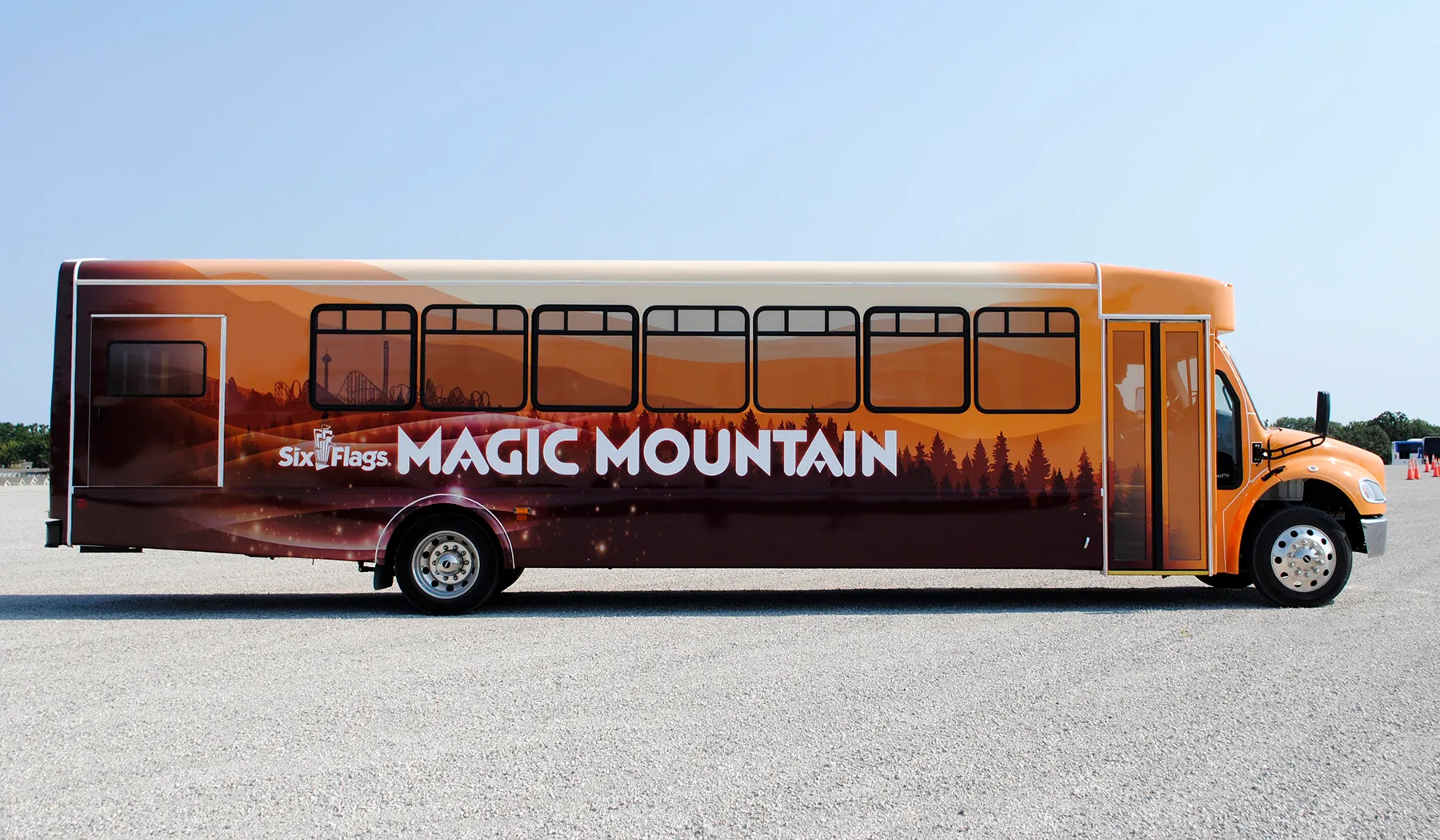 Side view of a Six Flags Magic Mountain bus wrapped by National Wrap Co.