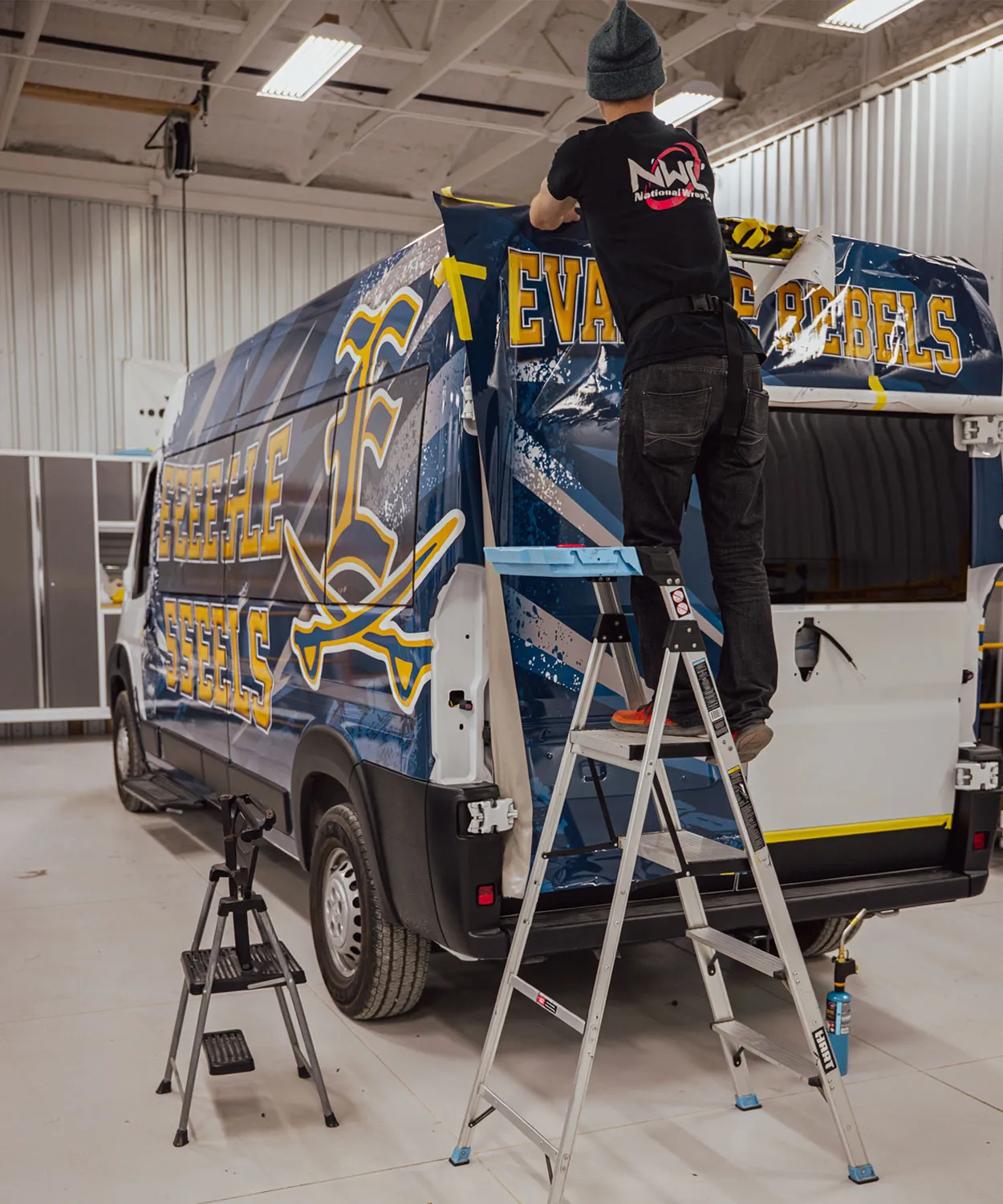 Installer at work in National Wrap Co. hangar.