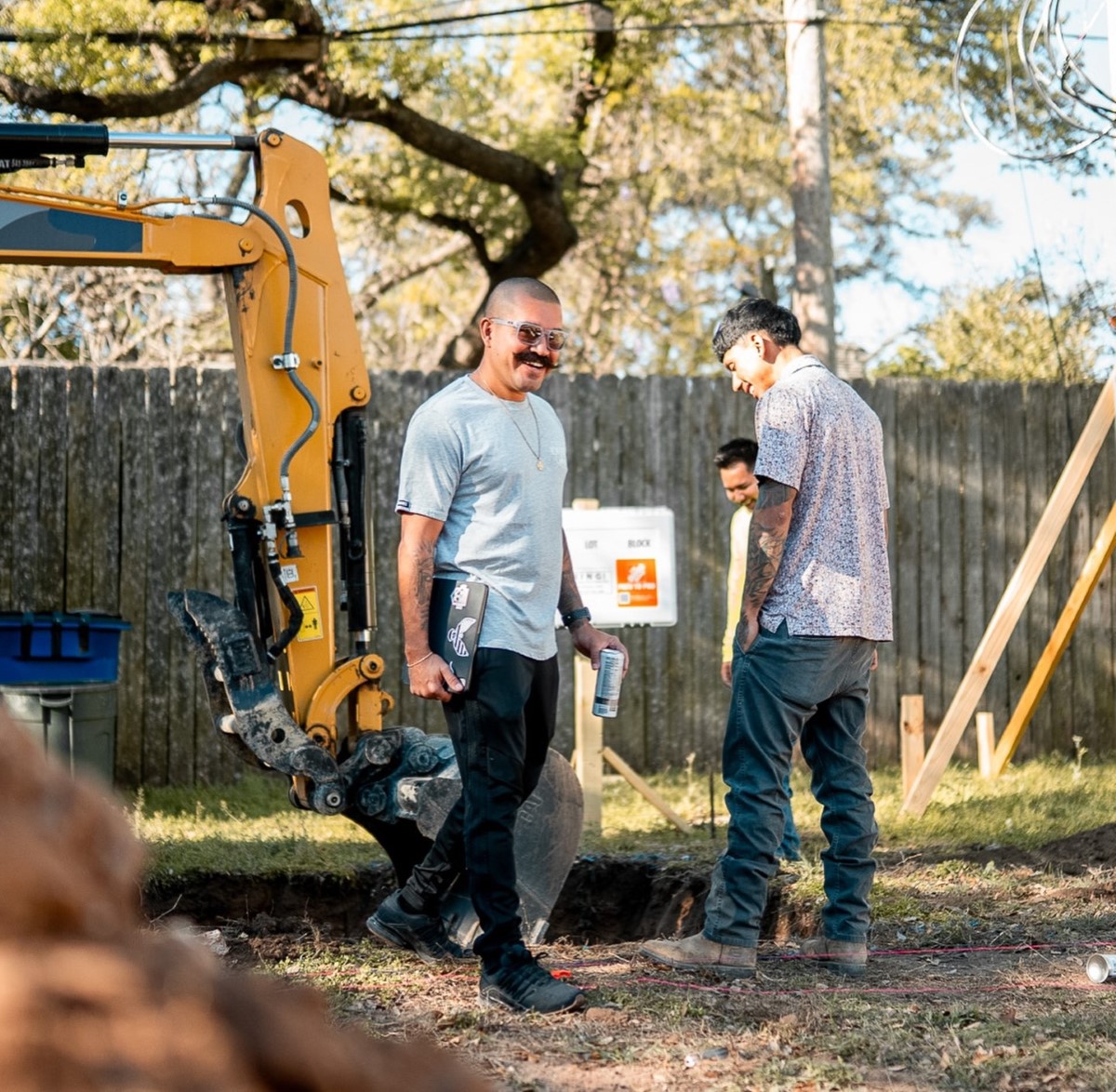 Texas Twins Pools workers build custom pool with excavator in backyard