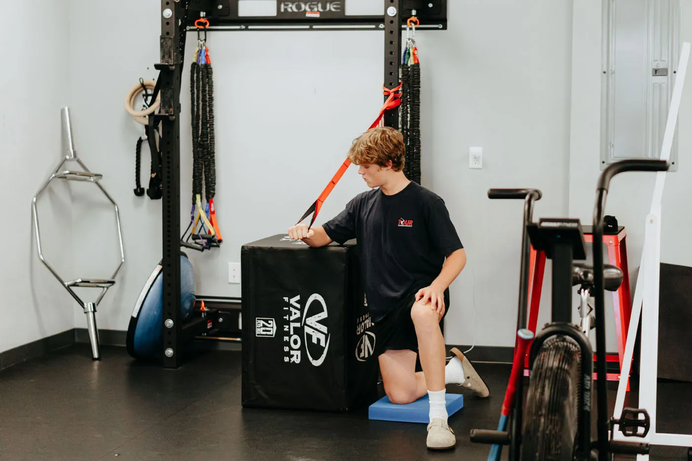 Young patient performing a resistance band exercise during physical therapy