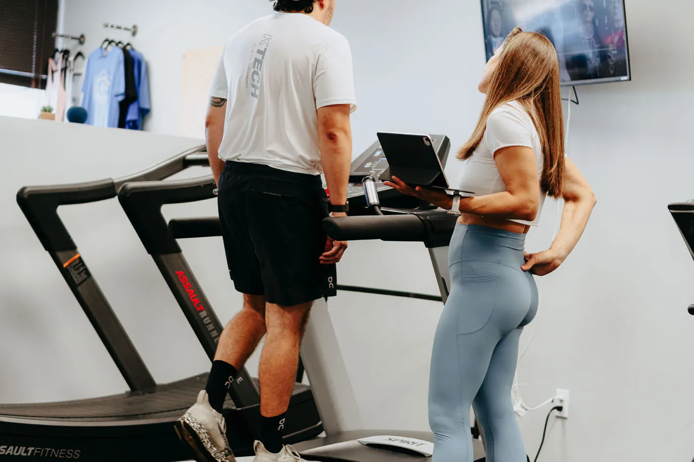 Physical therapist performing a treadmill gait assessment
