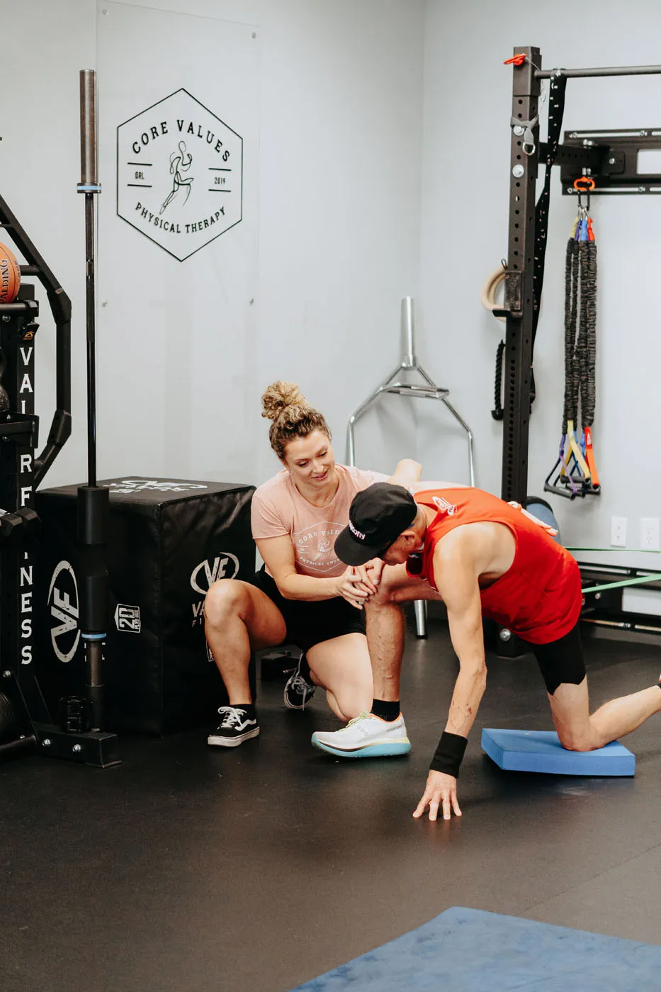 Physical therapist performing a knee assessment on a patient