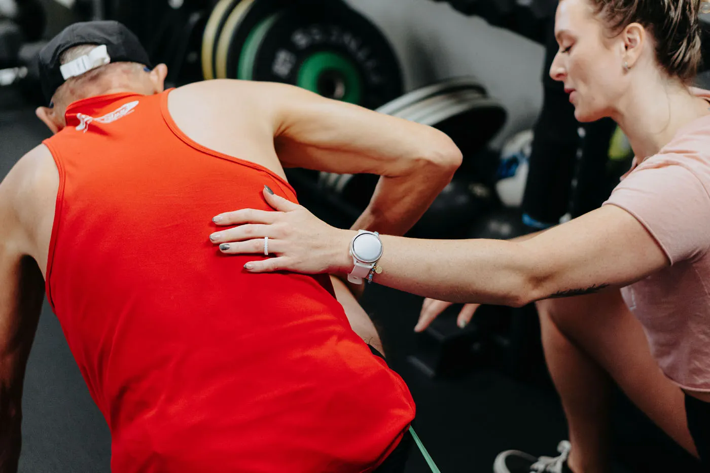 Physical therapist performing a manual back assessment on a patient