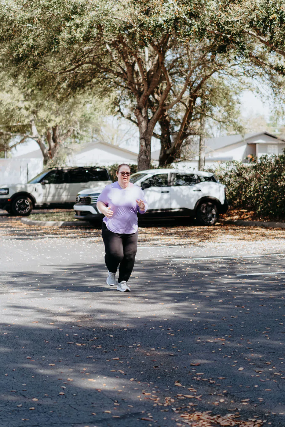 Patient running outdoors during physical therapy rehabilitation