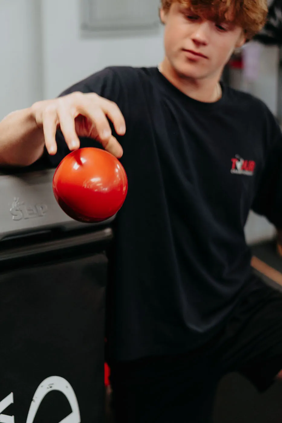 Patient throwing a medicine ball during a physical therapy exercise