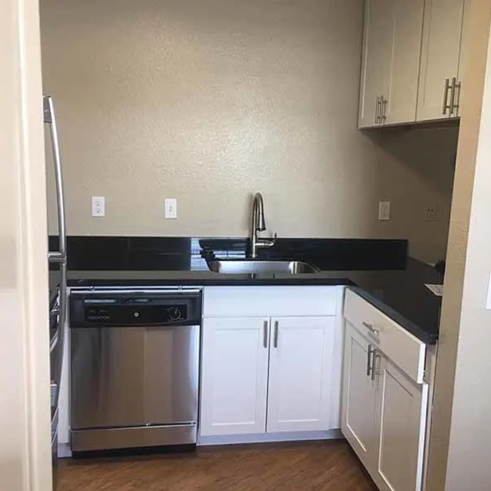 Kitchen with white cabinets and stainless steel appliances