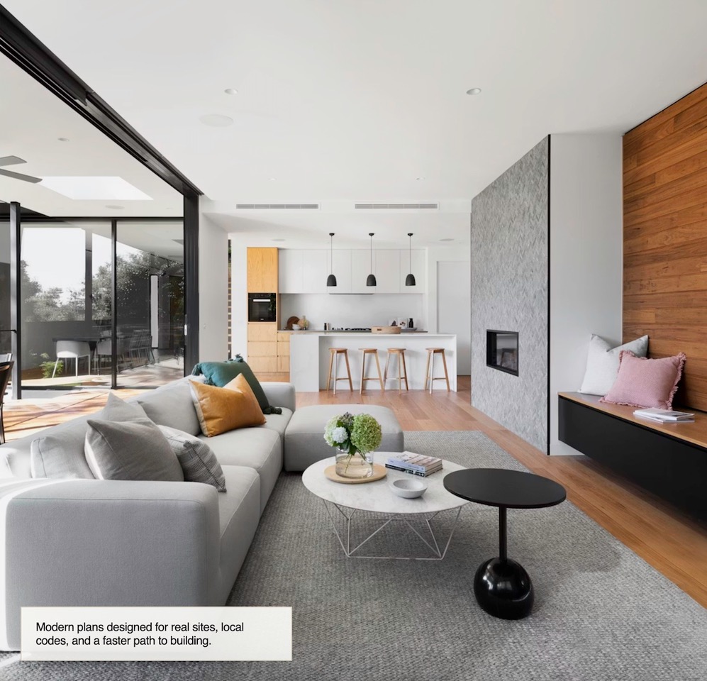 Interior image of a beautifully designed home. It show elegant furniture, large window, fire place and inviting bright kitchen.