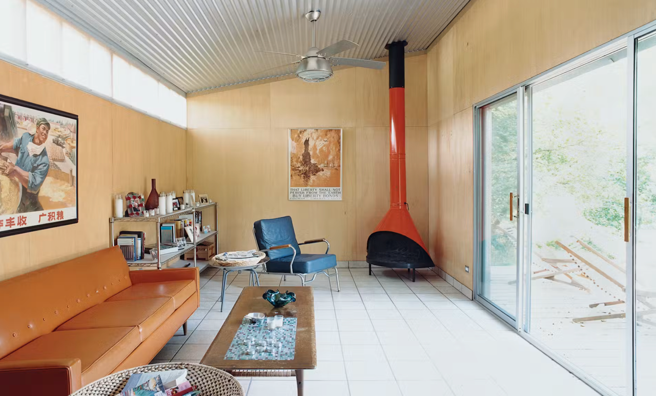 A beautifully designed home, view from the front with inviting entryway, large windows and front garden.