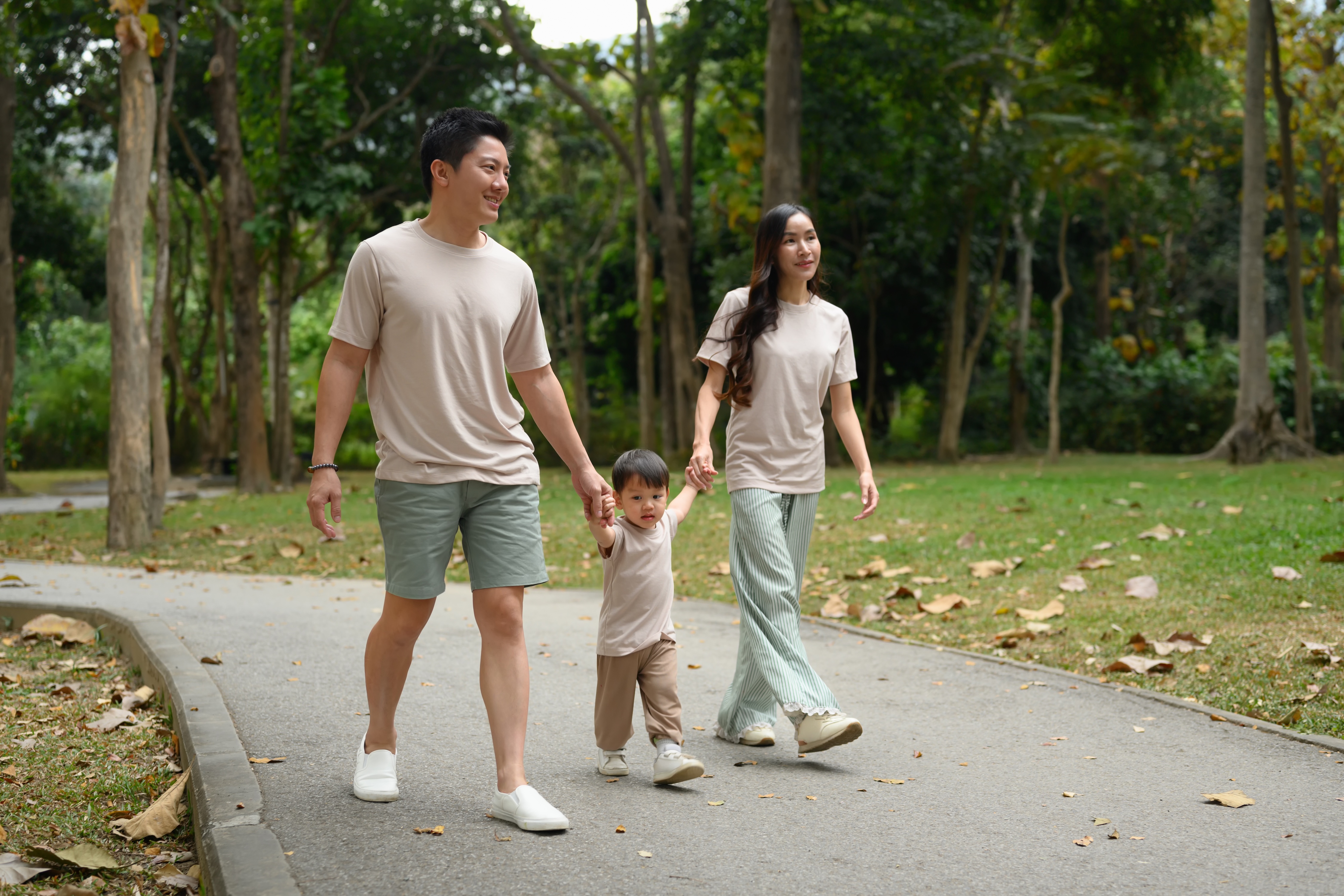Family walking through sidewalk stock image