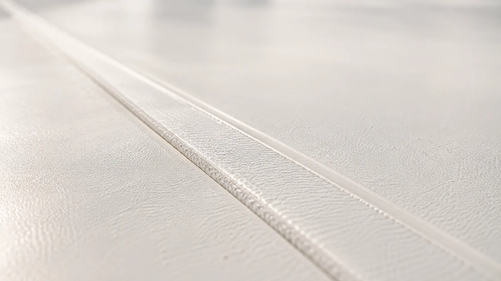 Flat roof with white single-ply membrane, drain and edge metal
