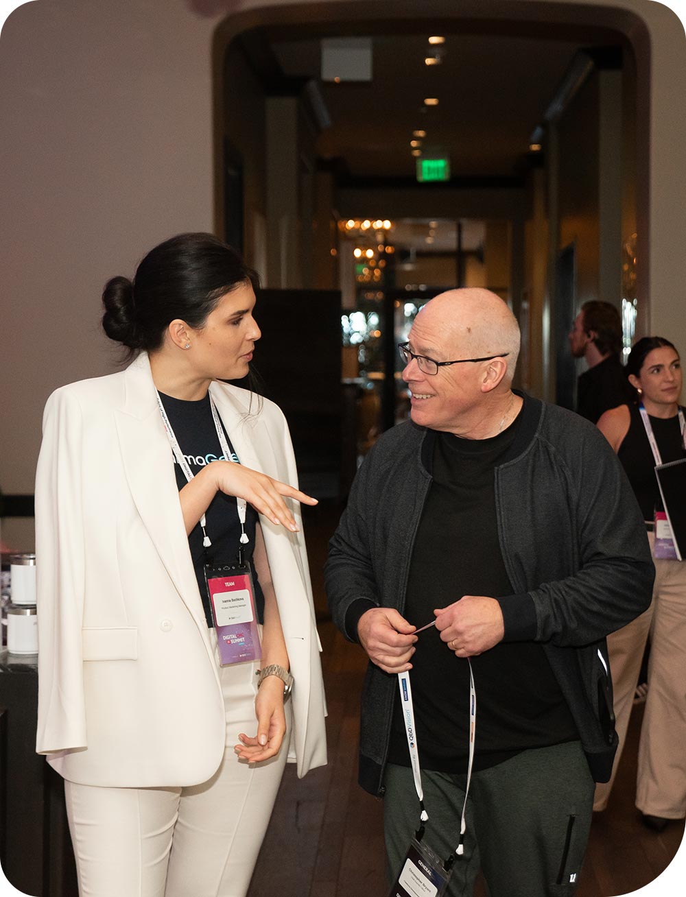 Two conference attendees having a discussion at QbDVision's Digital CMC Summit
