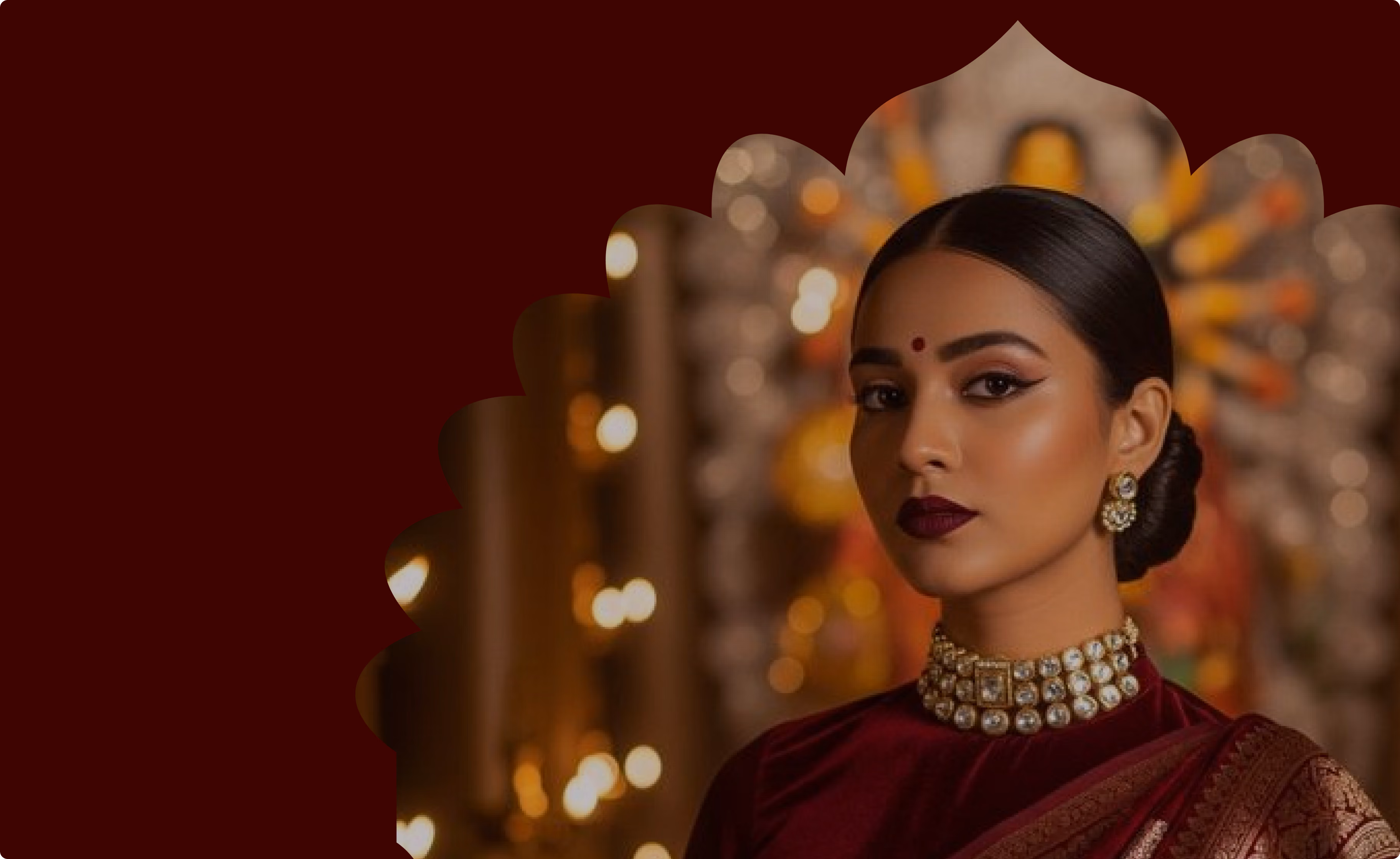 Anuradha Shopify store case study by Burgundy: woman in traditional jewellery and a red saree against warm bokeh