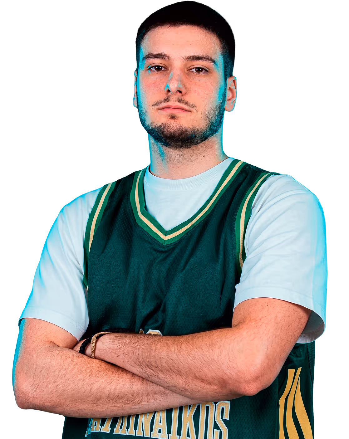 Young man with short hair and beard wearing a green basketball jersey with crossed arms.