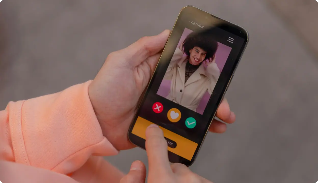 Close-up of a person using a dating app on a smartphone.