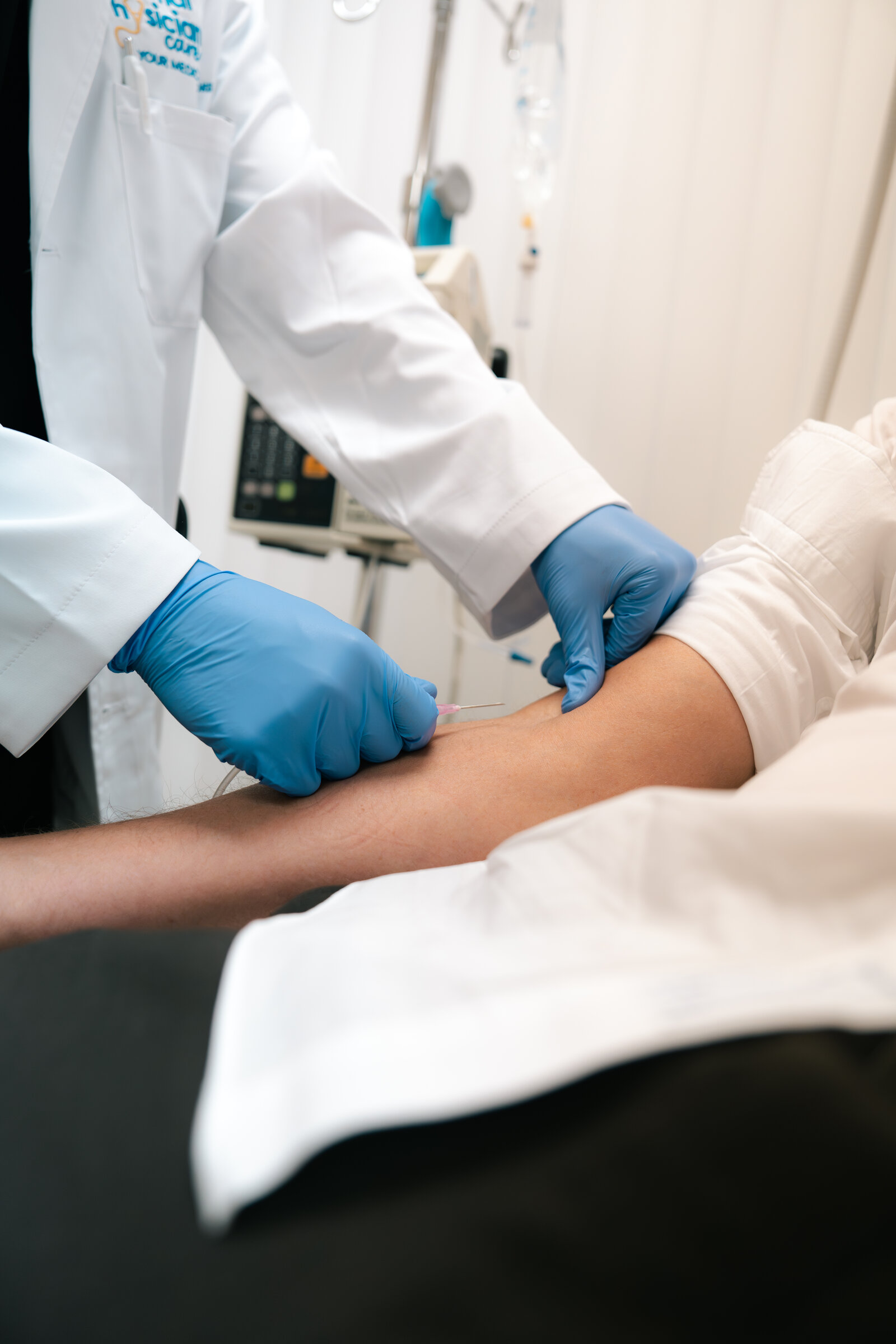 A Personal Physician Care clinician giving an injection treatment
