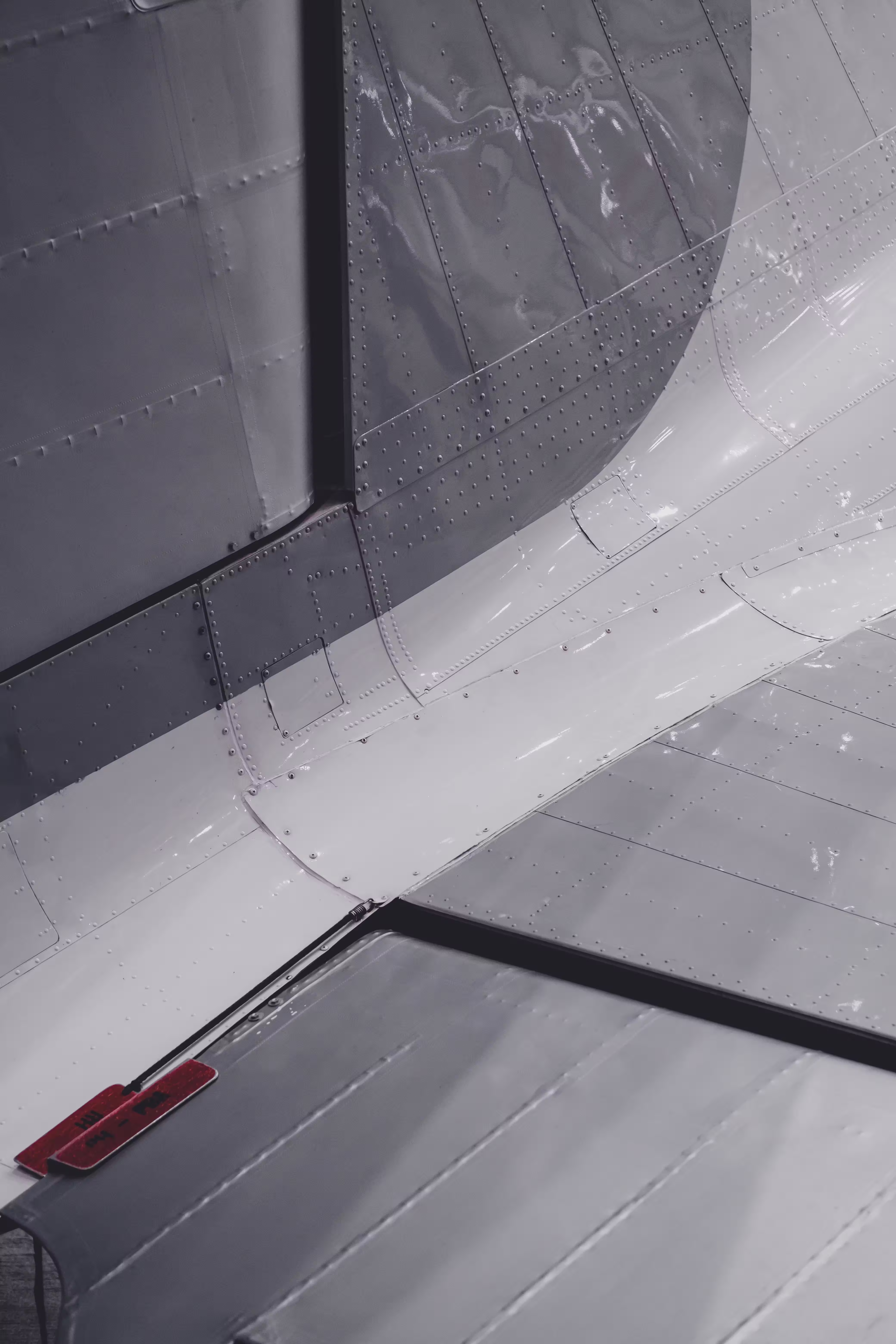 Detail of a business jet wing root and fuselage underside