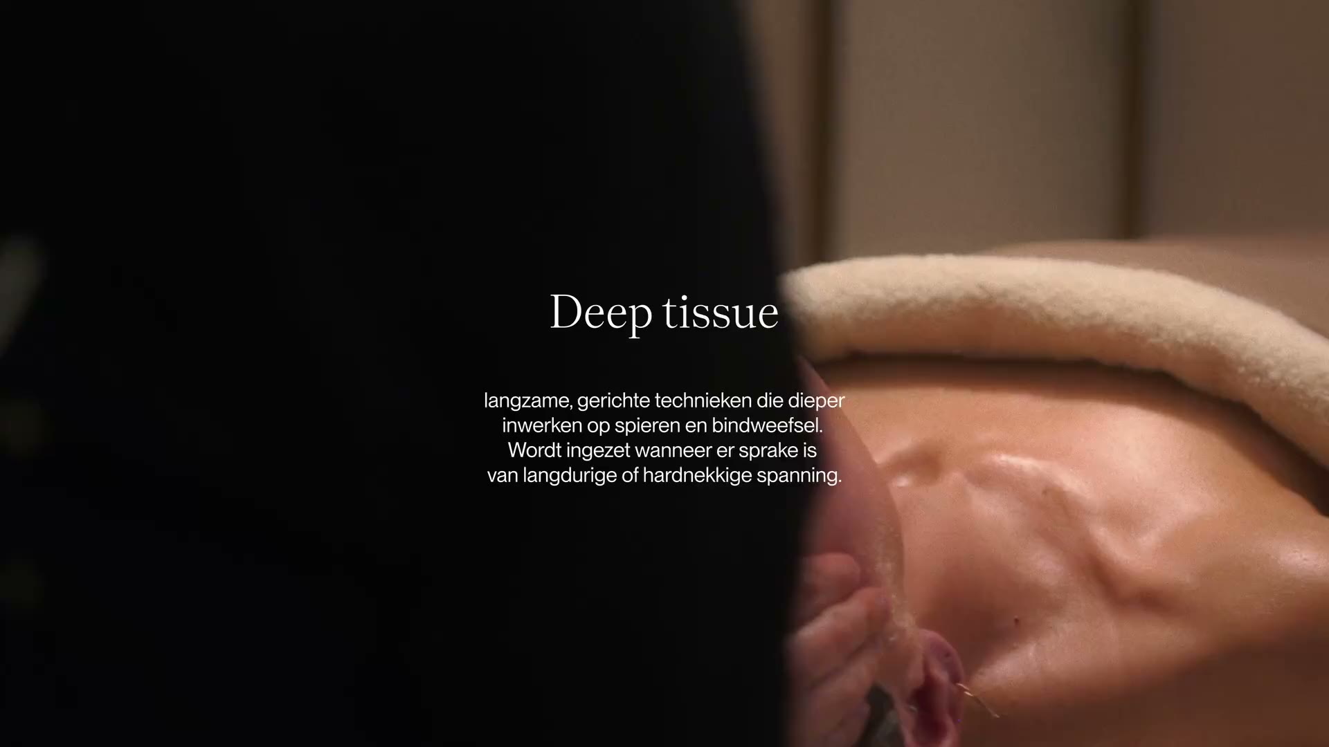 Deep tissue massage on a client's shoulders at Studio Release