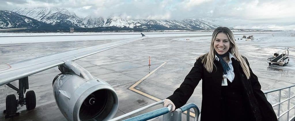 Lauren Thomas in her cabin crew uniform at the airport