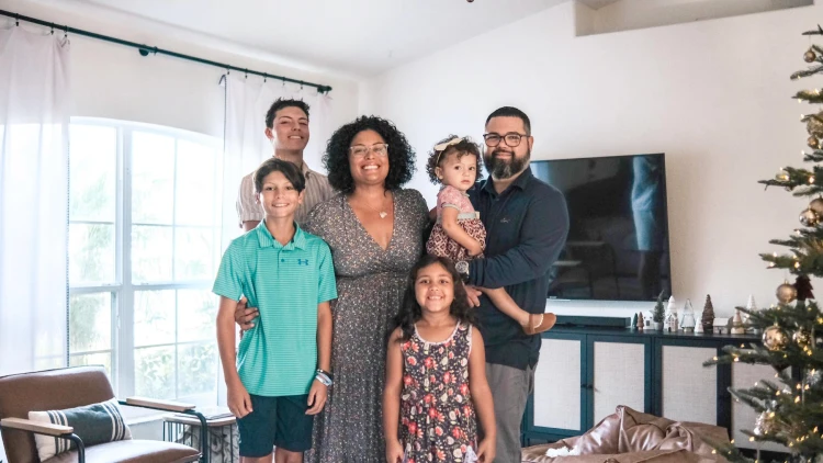Nichole Antomattei posing with her family for their holidays photo