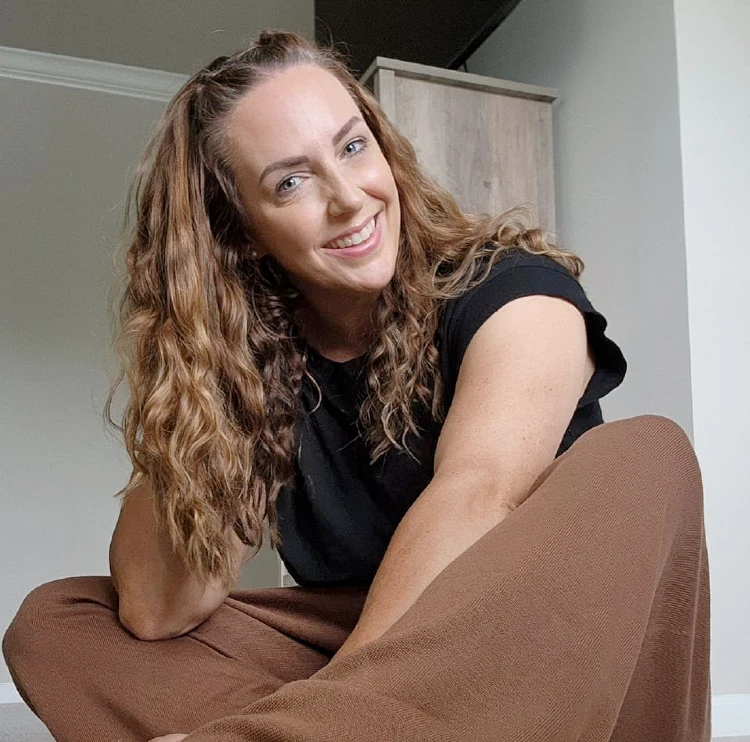 Jessica Hopkins sitting on the floor with legs crossed | Home decor influencers