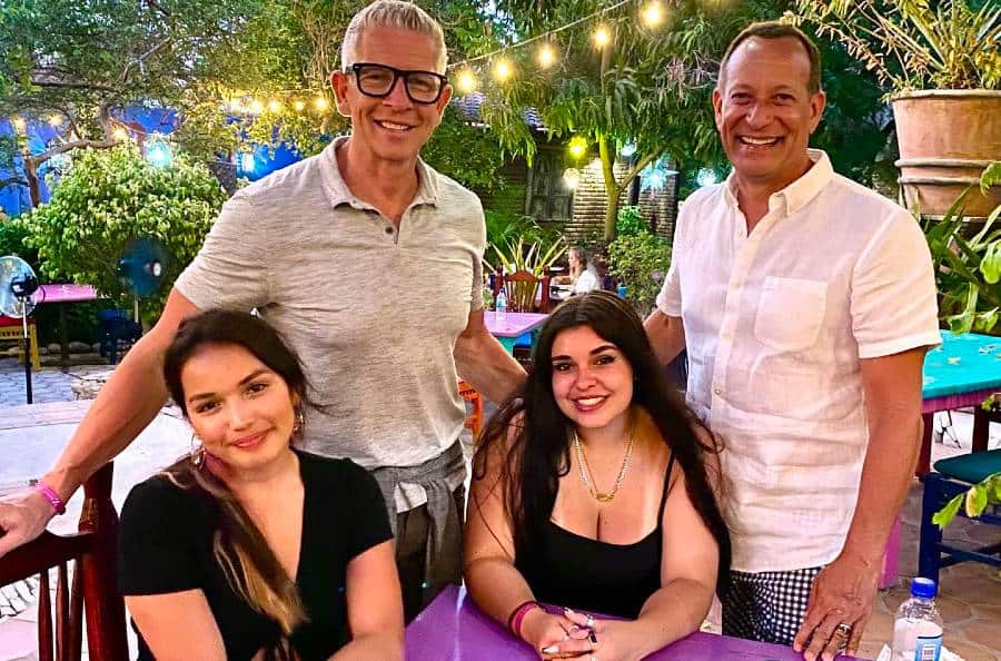 2dadswithbaggage family posing at restaurant