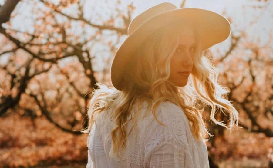 Catherine Pullan walking outdoors with the warm sunset