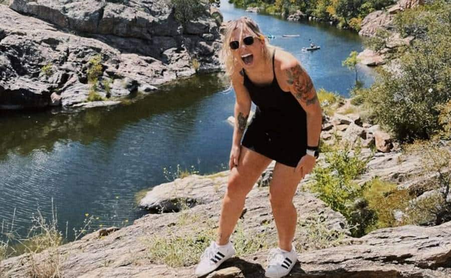 Taylor Sometimes laughingon mountain top overlooking river