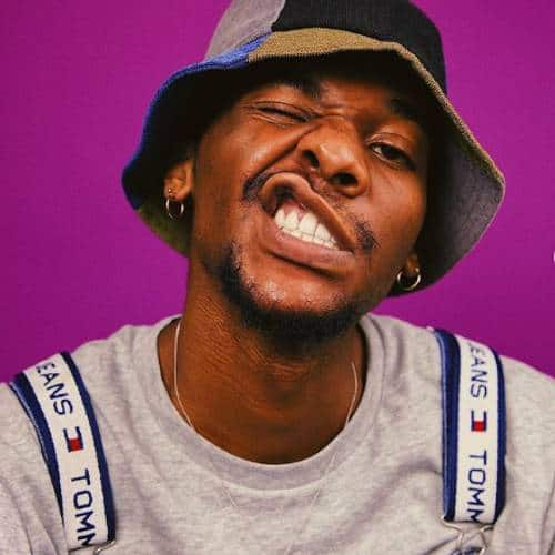 Jarrett Lampley in a hat and dungarees | Artist and Proud Member of the Black Community