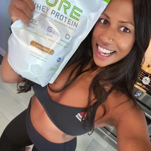 Natalie Anderson in workout gear promoting pure whey protein