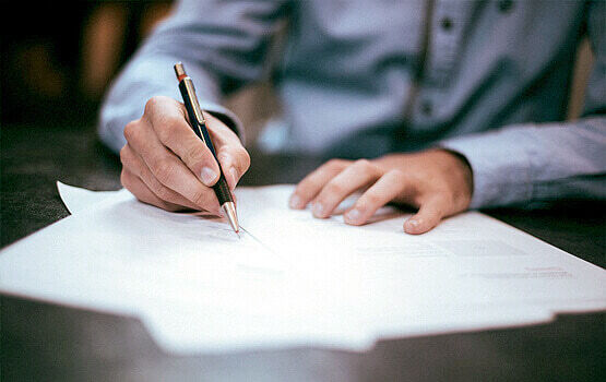 An inspection report being written up by hand