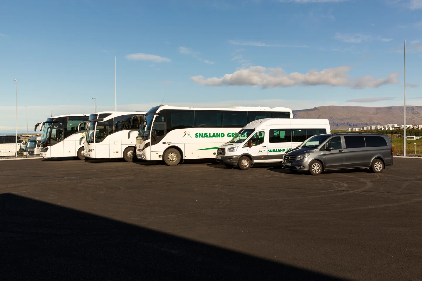 Snaeland Travel Buses and Private Shuttles parked in Reykjavík Iceland.