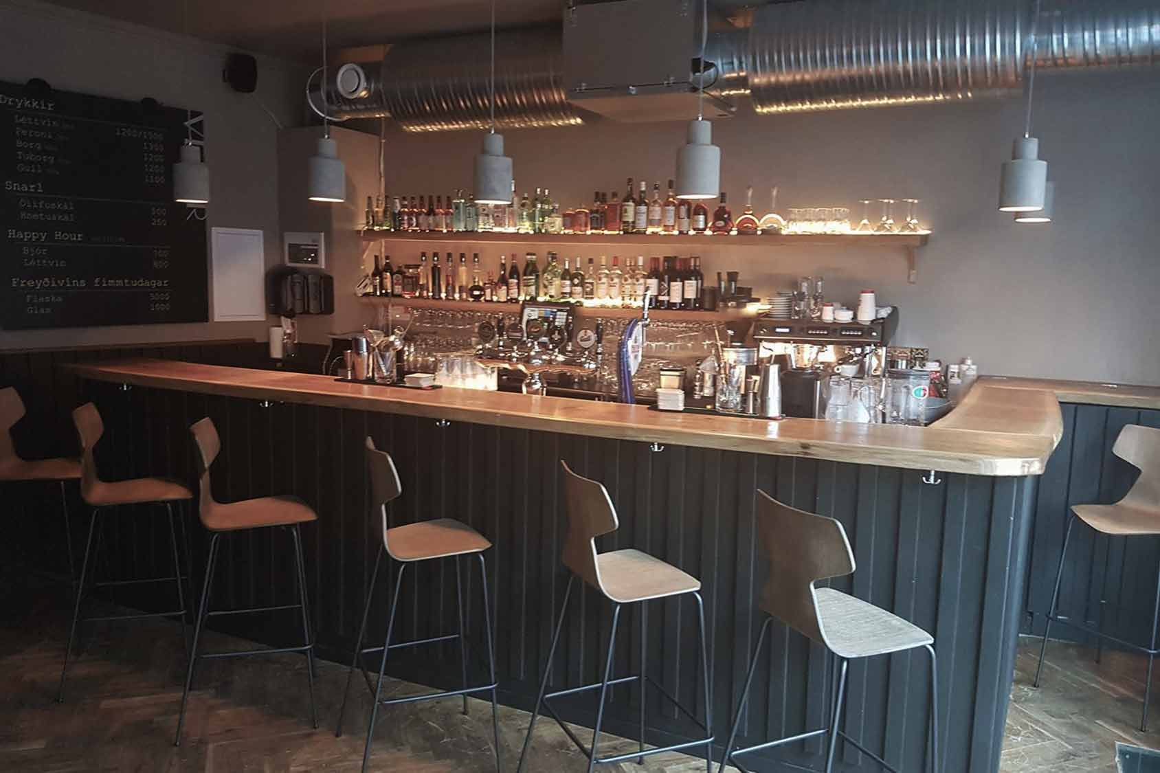 Interior of Veður Wine and Cocktail Bar in Reykjavik, featuring chic interior at the bar.