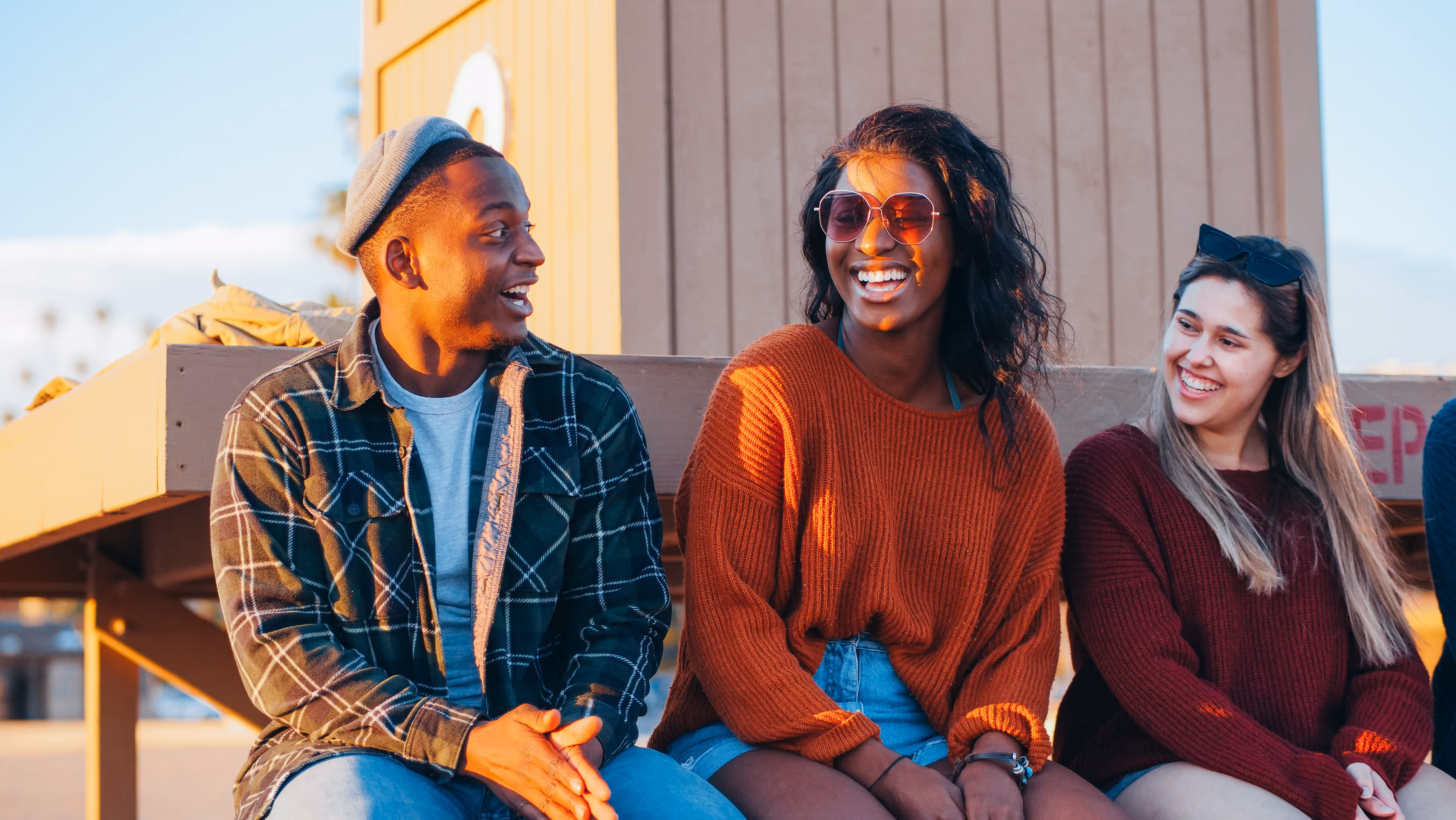 Group of friends sitting on beach stock image