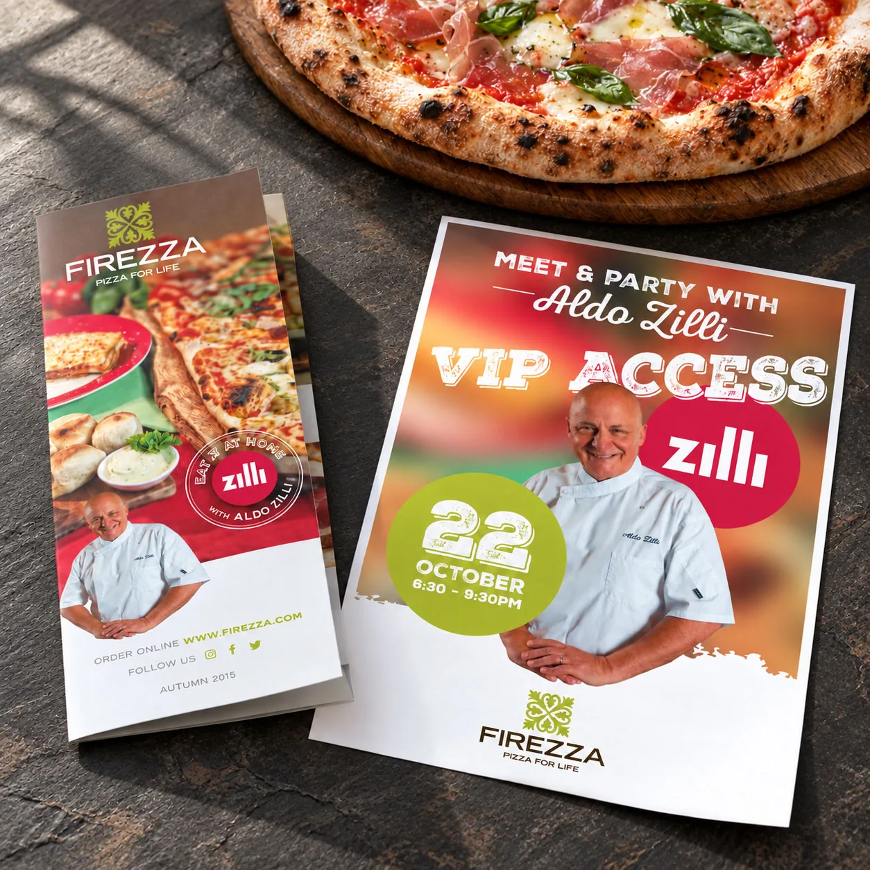 Firezza flyers for a VIP evening with chef Aldo Zilli on 22 October, laid beside a pizza