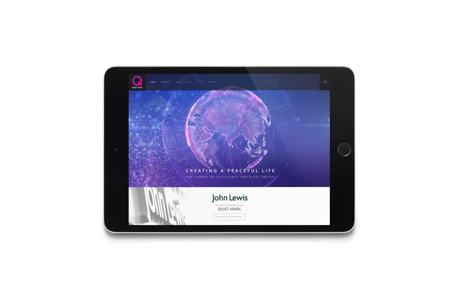 A tablet showing the Quiet Mark website, with a glowing globe, the line Creating a peaceful life and a John Lewis partnership panel