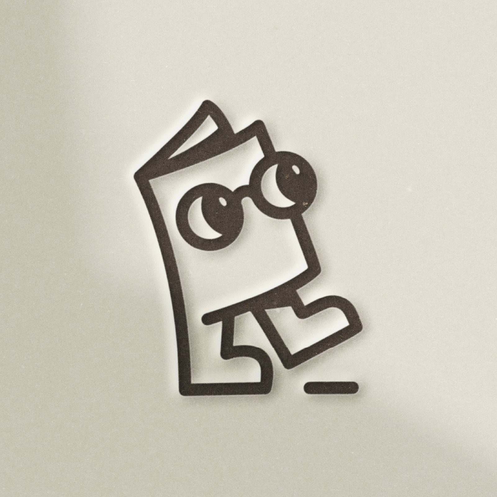 Libro, the Libraro mascot, a walking book in round glasses, debossed in dark brown into warm off-white paper