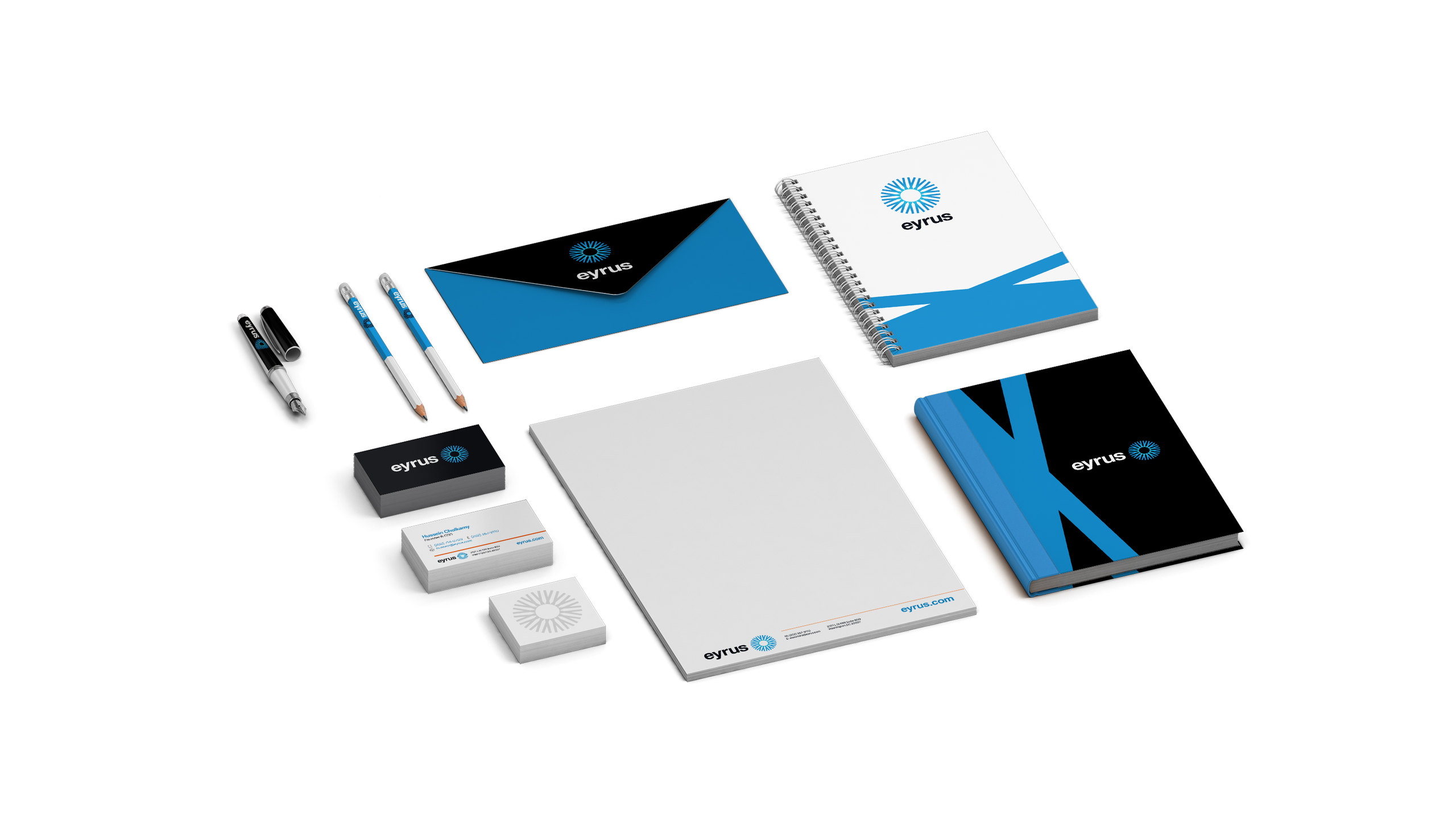 Eyrus stationery set: letterhead, business cards, an envelope, a notebook, a folder with the blue X shape and branded pens