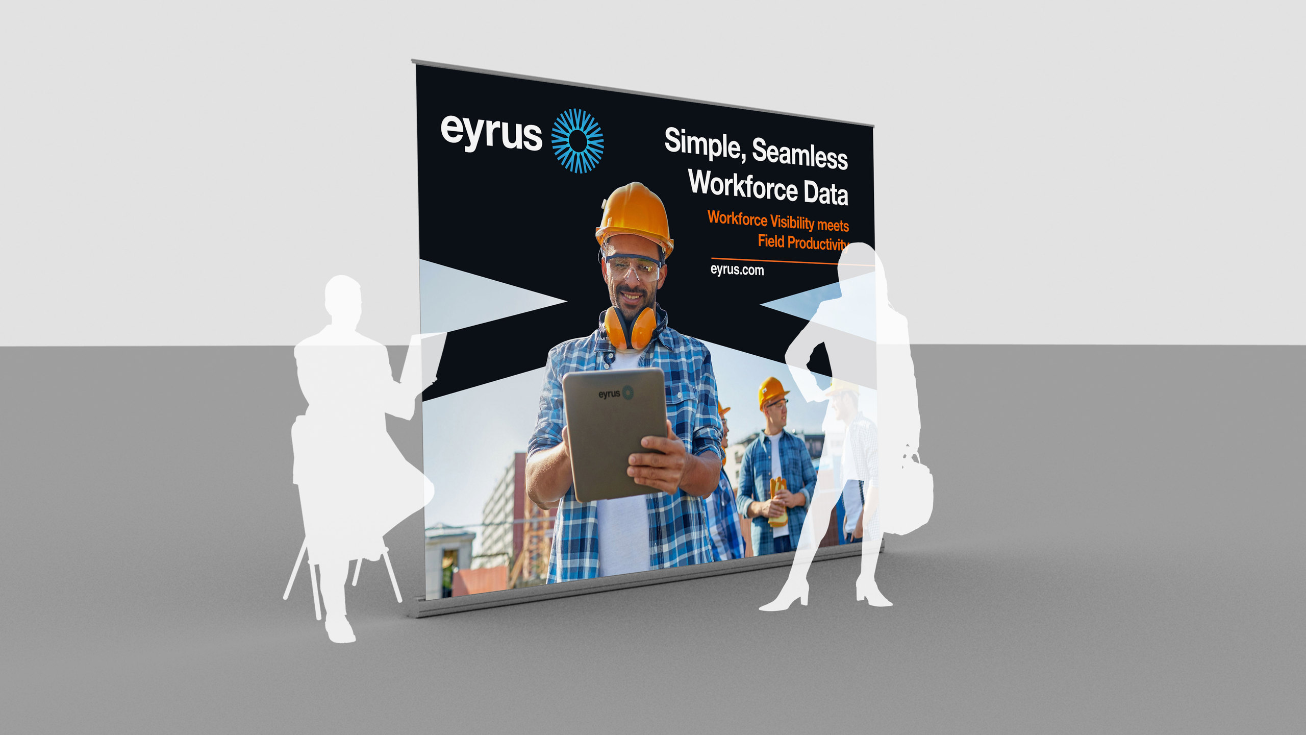 Eyrus trade show backdrop mockup reading Simple, Seamless Workforce Data, with a construction worker holding a tablet, shown at scale with two silhouetted figures