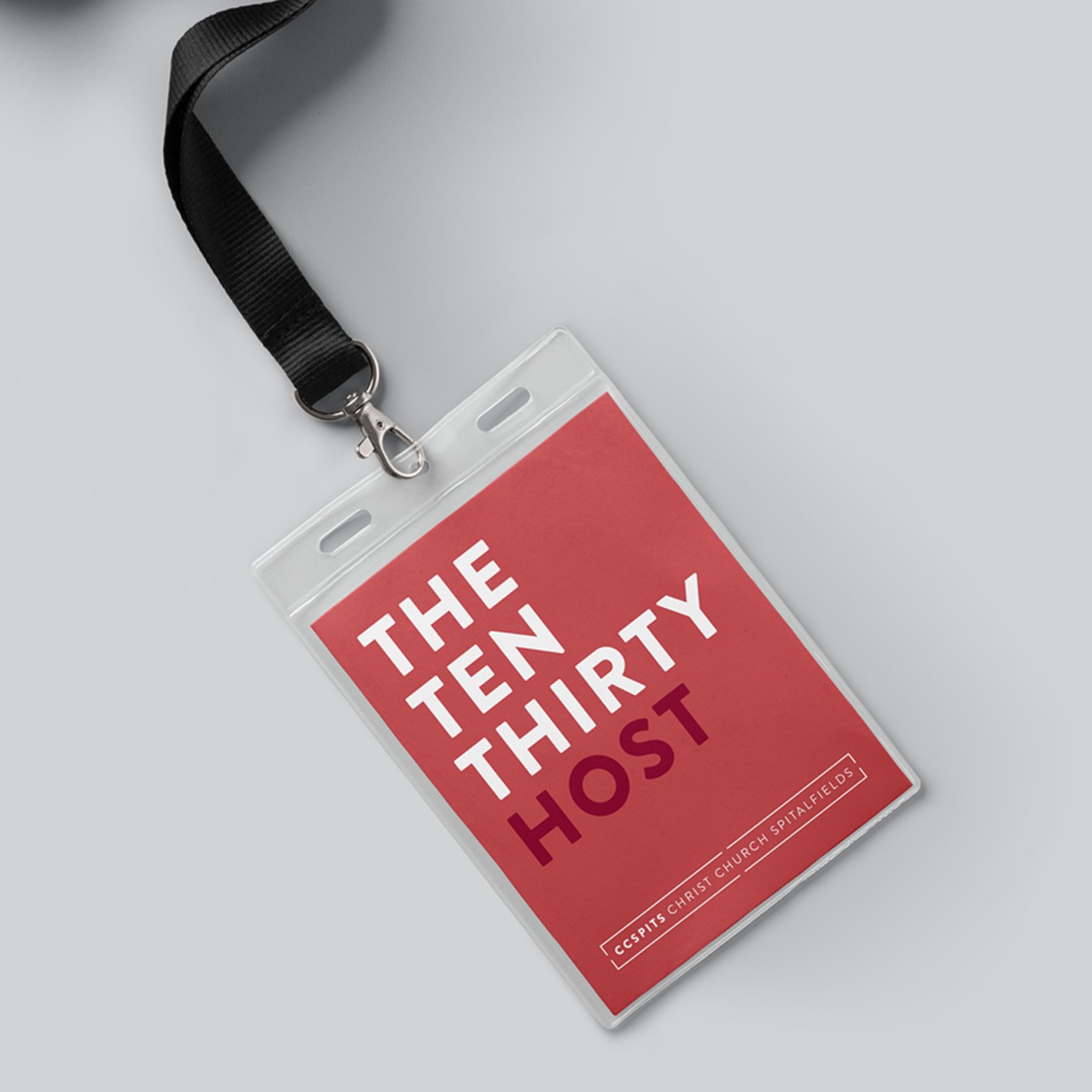A red lanyard badge reading The Ten Thirty Host in bold white and dark red capitals, with the Christ Church Spitalfields logo along the edge