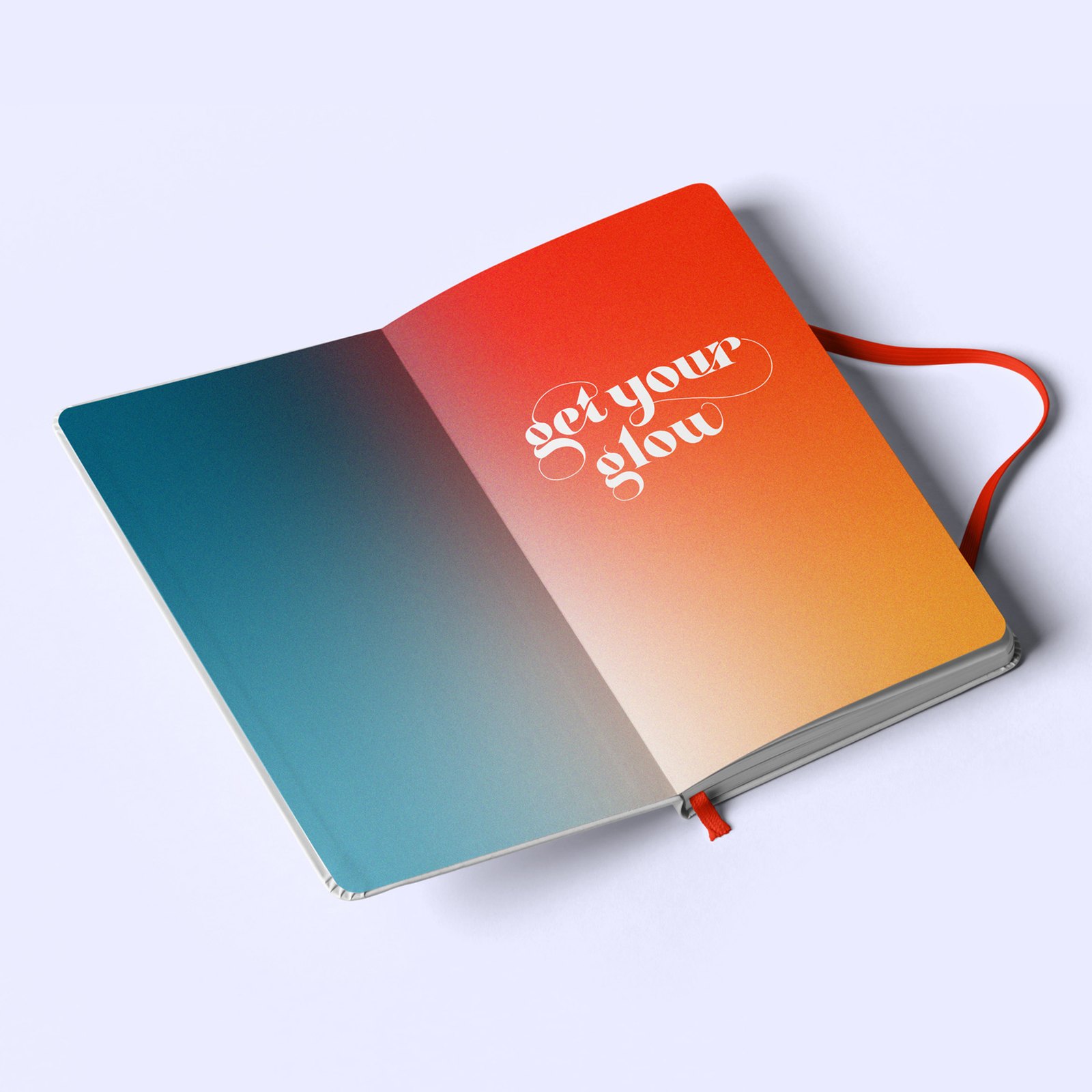 An open notebook with a teal to orange gradient spread and the words get your glow in white script, with a red ribbon marker