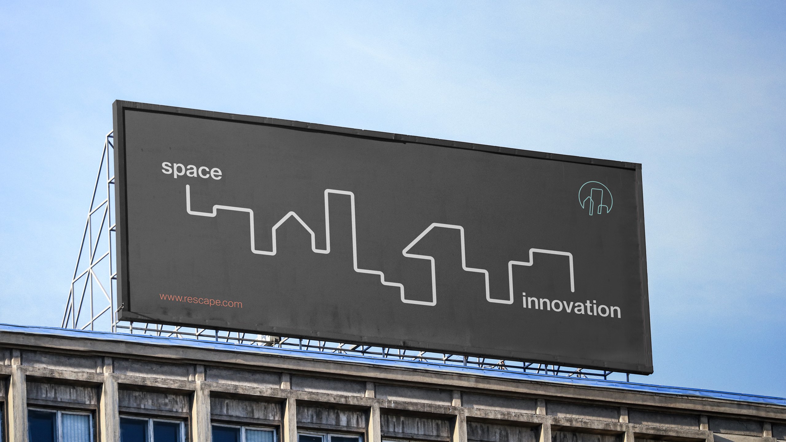 A Rescape billboard concept on a rooftop: a white skyline line running between the words space and innovation on a charcoal board