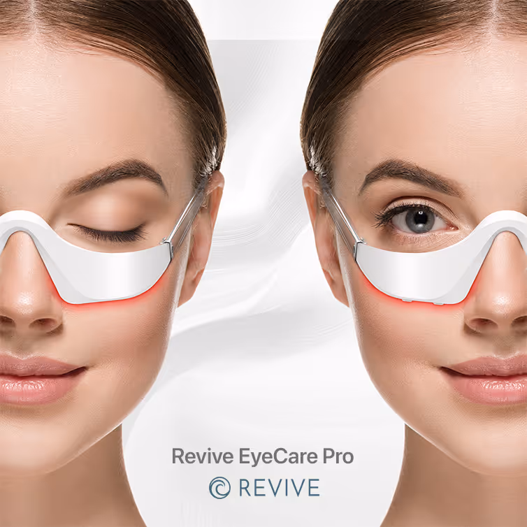 Close-up of a woman wearing a white under-eye light therapy mask, shown with one eye closed and the other open.