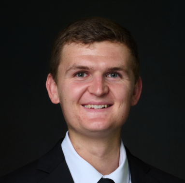 Headshot of Mr. Aidan Murtagh in a dark suit