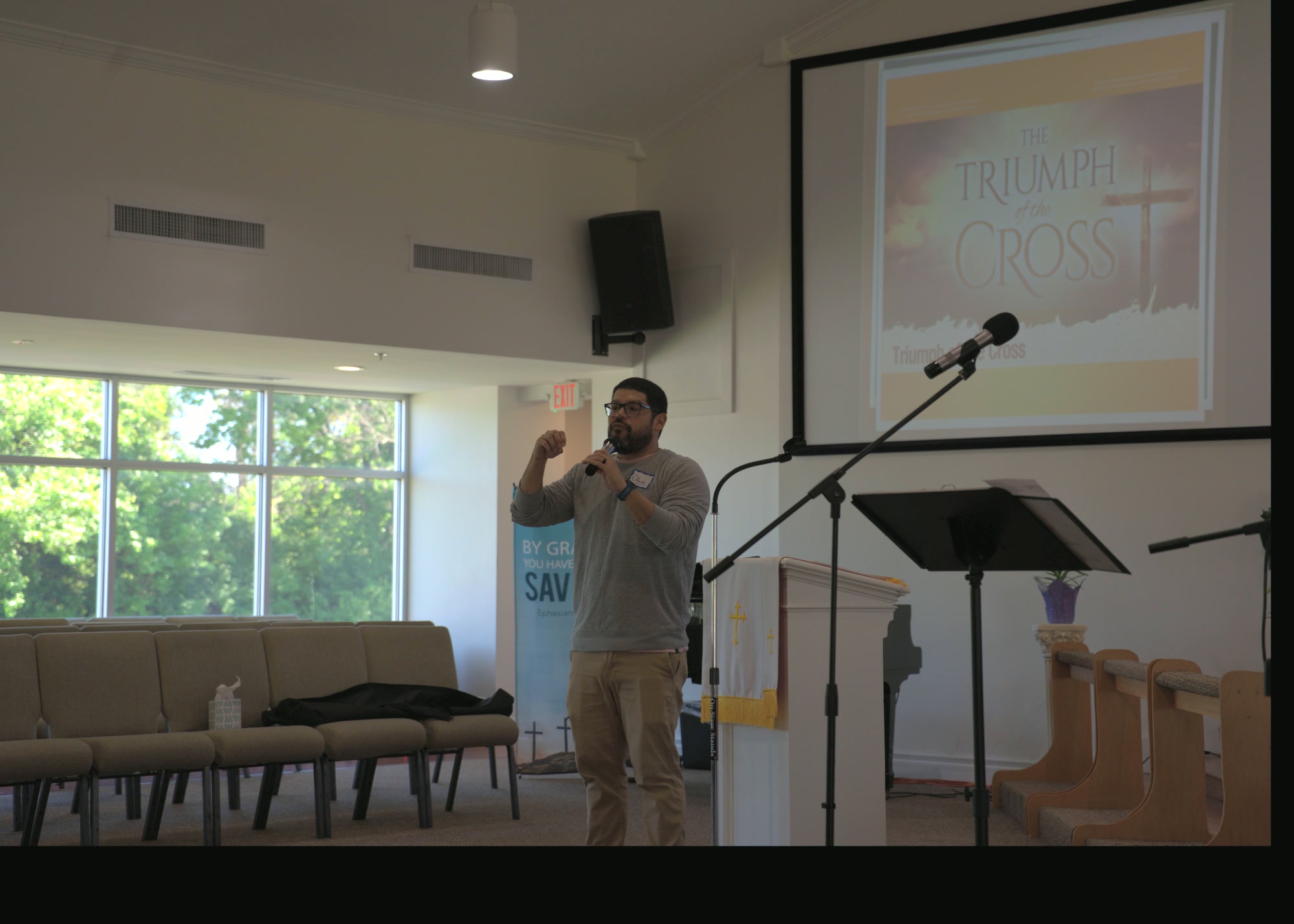 A leader speaking at a Triumph of The Cross prayer gathering