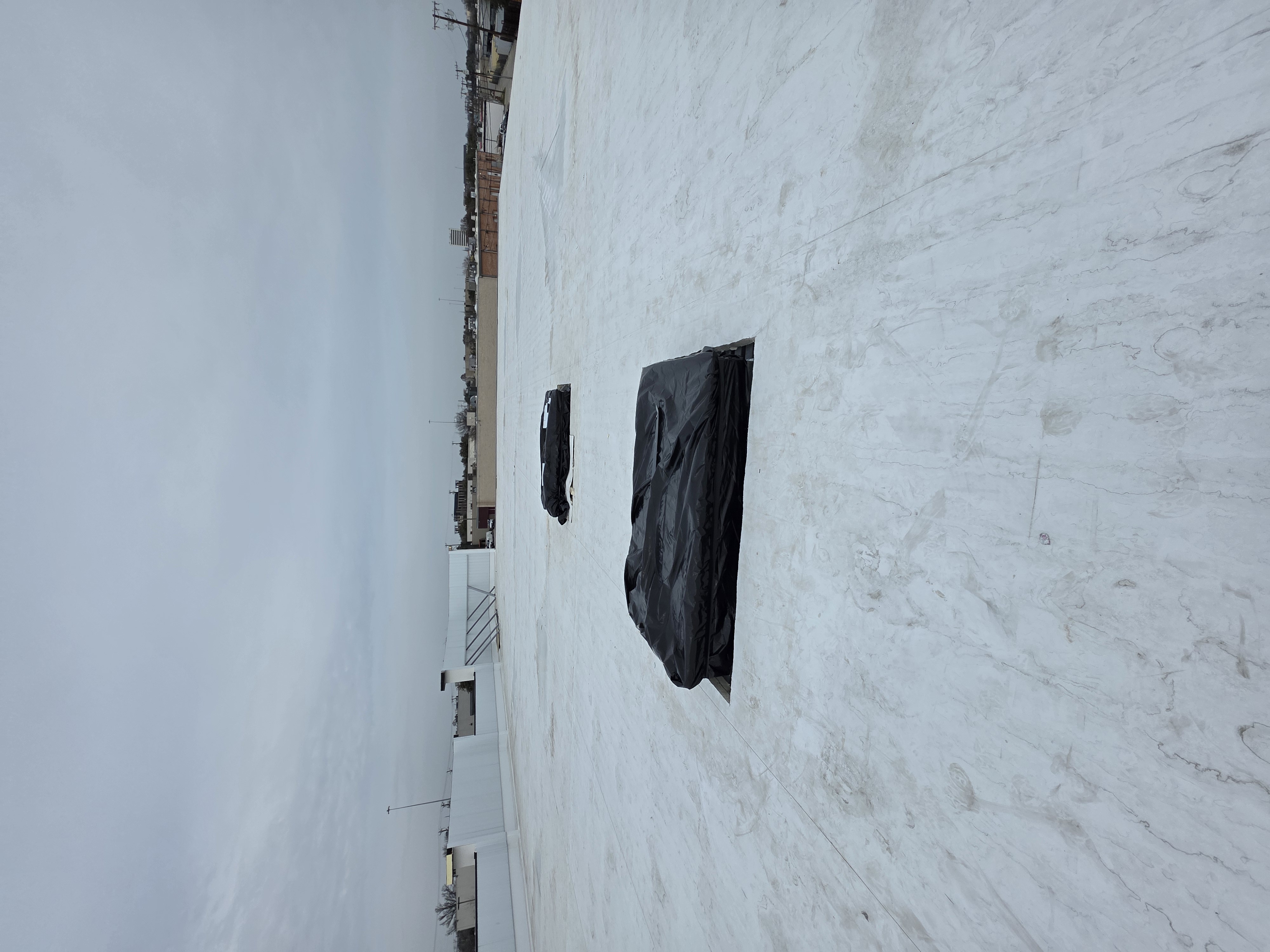 Rooftop curb covers staged for unit installation