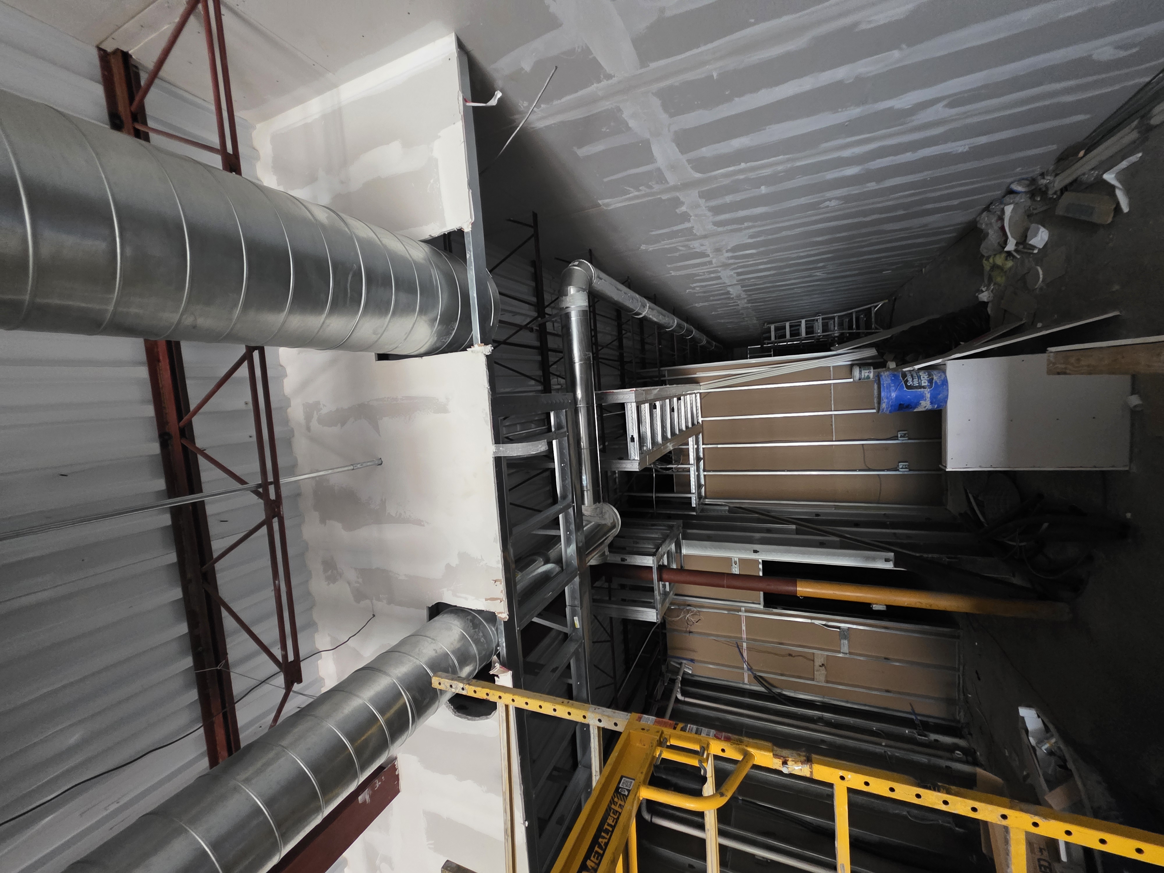 Spiral ductwork tie-ins through finished ceiling cavity