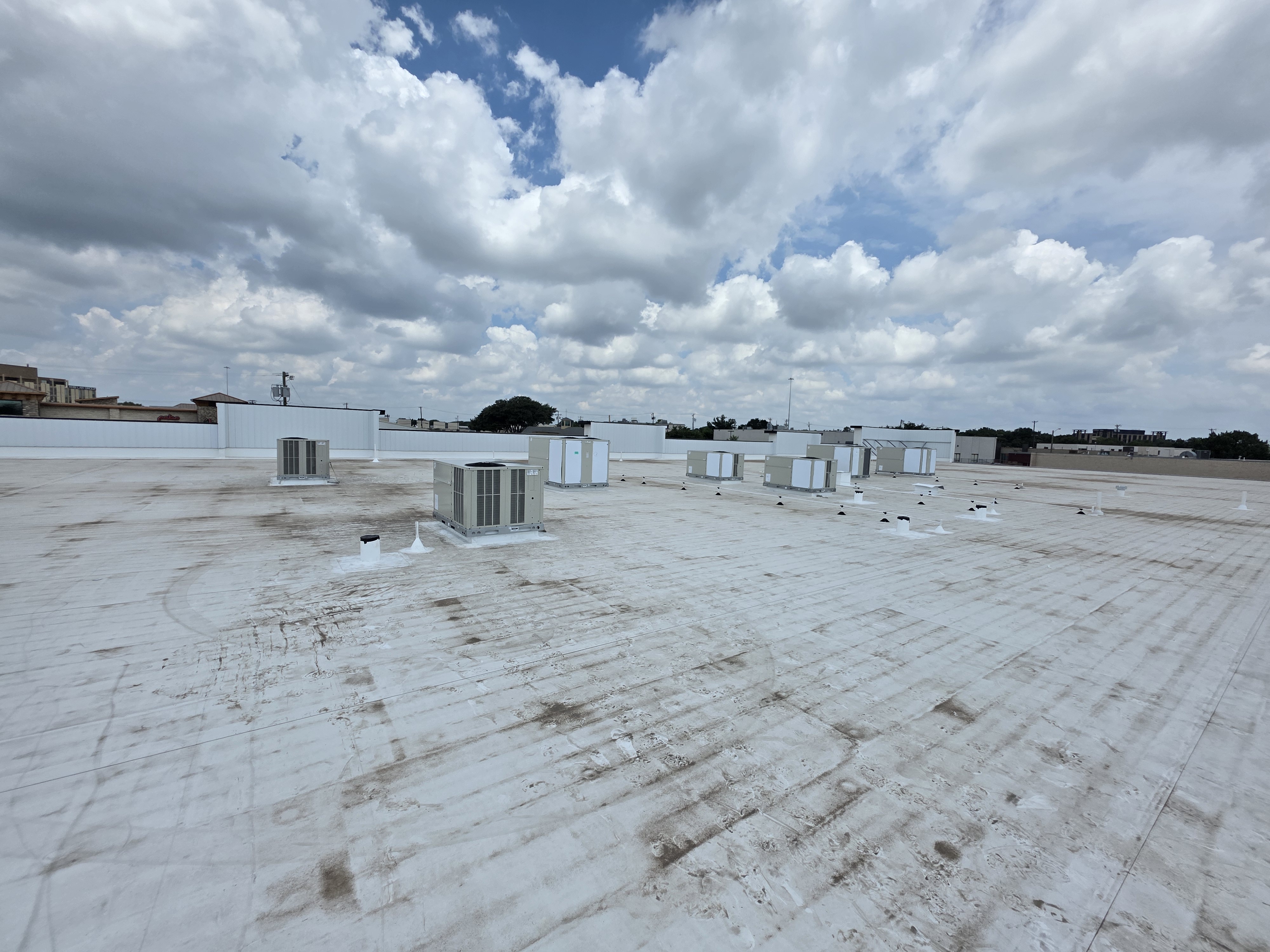 New Daikin rooftop package units set on curb
